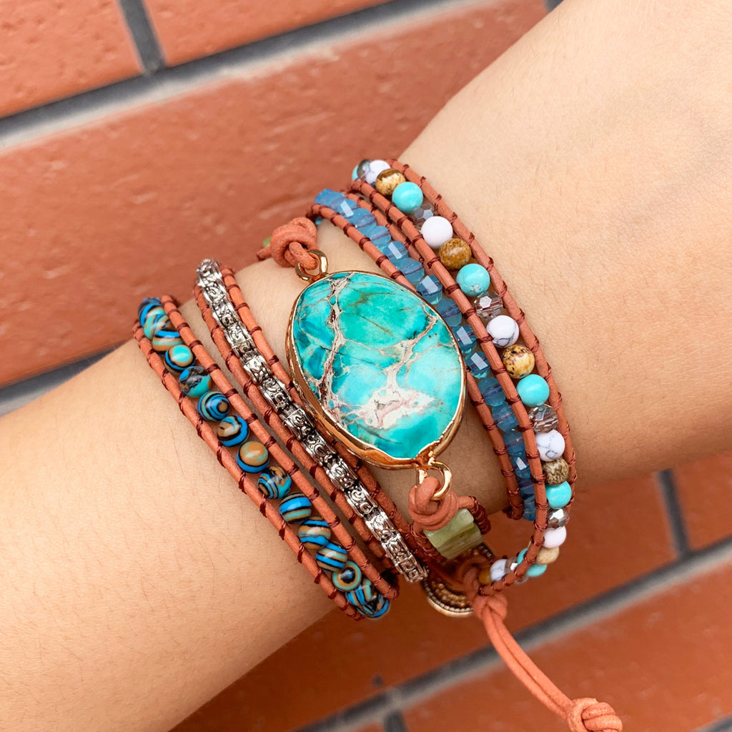 Turquoise wrap bracelet set with 5 layers displayed on wrist - bohemian multi-strand jewelry
