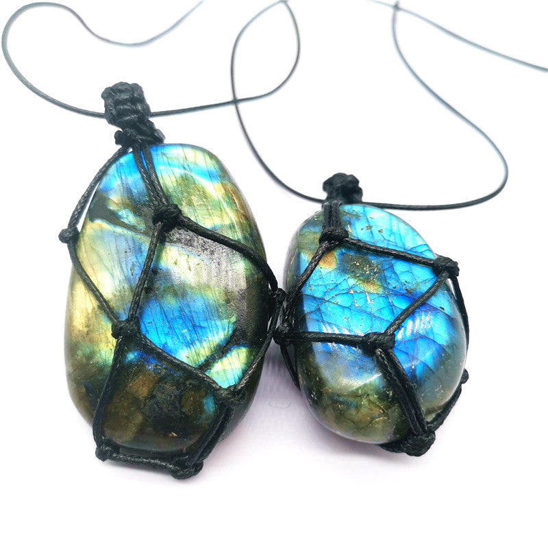 Raw labradorite crystal pendant with golden and blue flash highlights