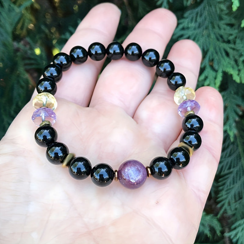 Gemstone energy bracelet with black and purple stones - side view